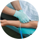 IV needle next to manikin arm