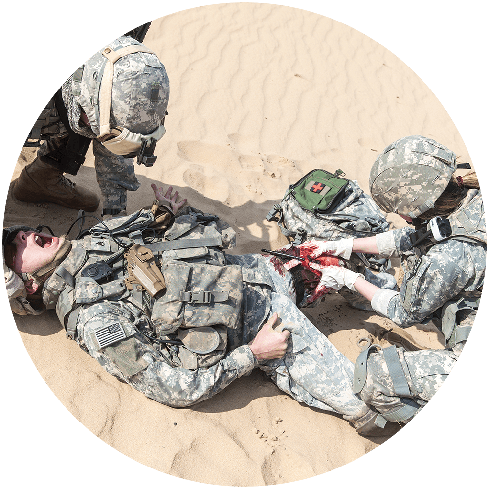 Military combat medics tending to a patient