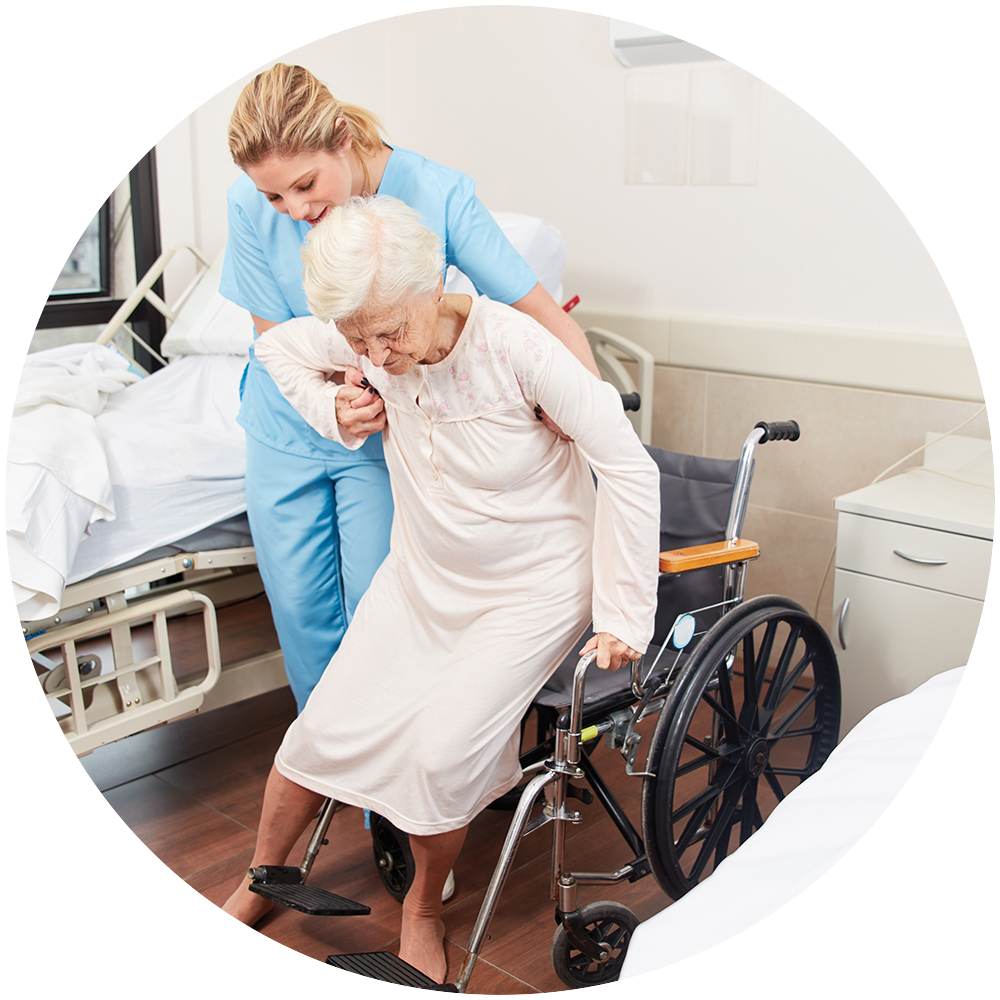 Nurse helping an elderly person out of a wheelchair