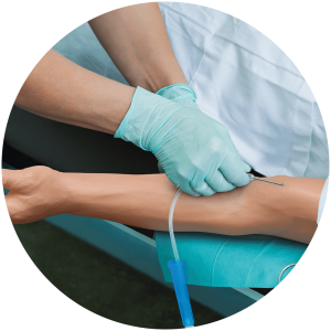 IV needle next to manikin arm