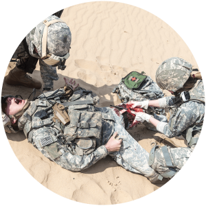 Military combat medics tending to a patient